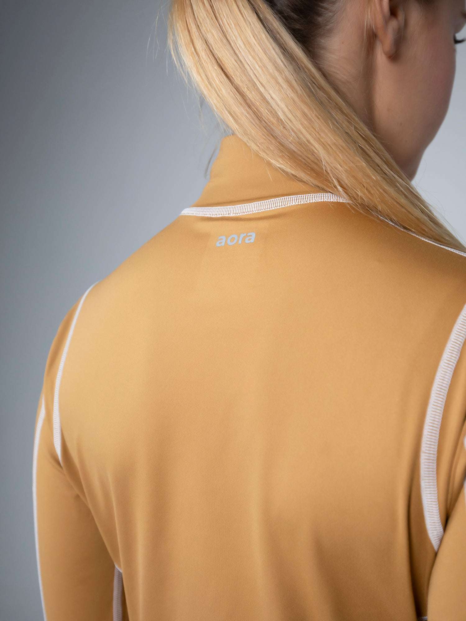 KANZEI ZIP LONGSLEEVE For Women - Aora Athliesure Shop online in Abu Dhabi